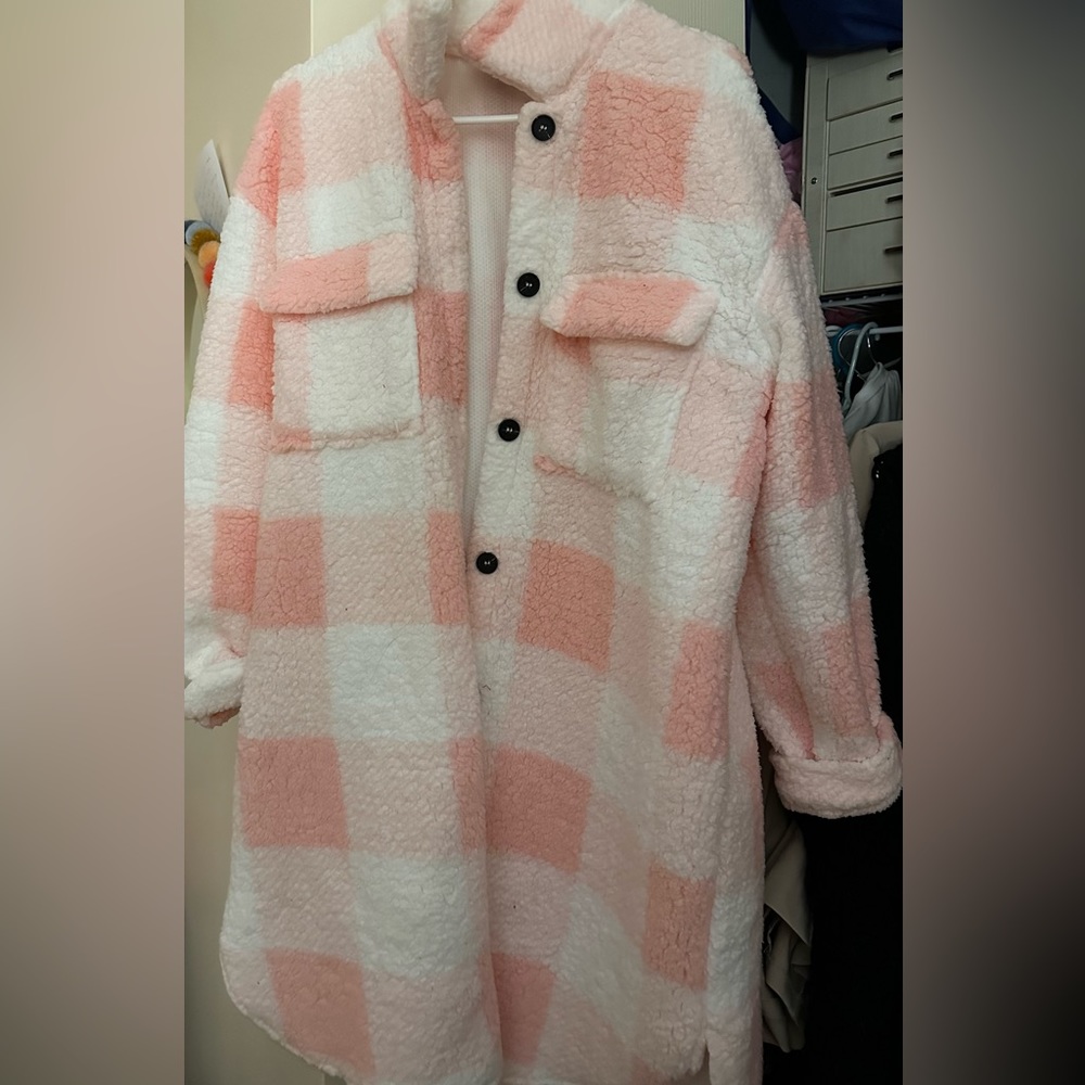 Pink and white jacket.